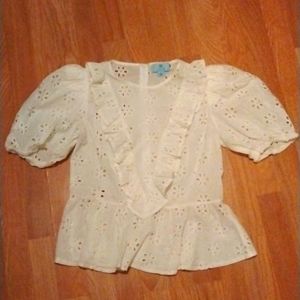 White shirt with flower design on it